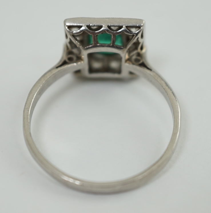 A 1930's/1940's platinum, emerald and diamond cluster set tablet ring